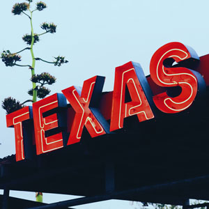 Texas Cities by Educational Attainment. The Word TEXAS in Red Neon. Photo Credit: Enrique Macias on Unsplash [https://unsplash.com/photos/BXXYZ4HtGxU]