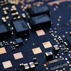 A circuit board. Photo Credit: Living Smarter on Unsplash [https://unsplash.com/photos/jZ2Pok_St8A]