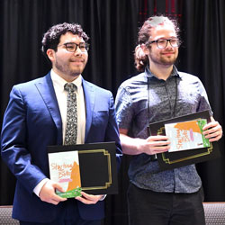 Biomedical engineering senior Edgar Acevedo (left) and Roger Decker III BS’22 accepted a first-place award for their project during the 2022 Capstone Design Conference in June at UT Dallas.