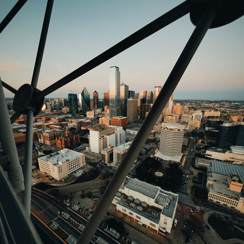 The Connection. Photo Credit: A portion of the Dallas skyline as seen from inside the spherical latice atop Reunion Tower. Photo Credit: Aleksey Kuprikov on Unsplash [https://unsplash.com/photos/xofVIj42gn4]